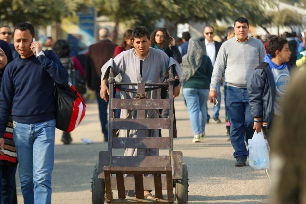Man Pushing Metal Cart at Cairo International Book Fair – 2017 5