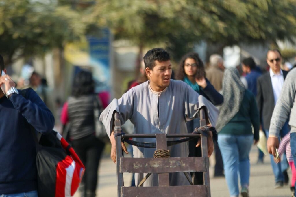 Man Pushing Metal Cart at Cairo International Book Fair – 2017 6