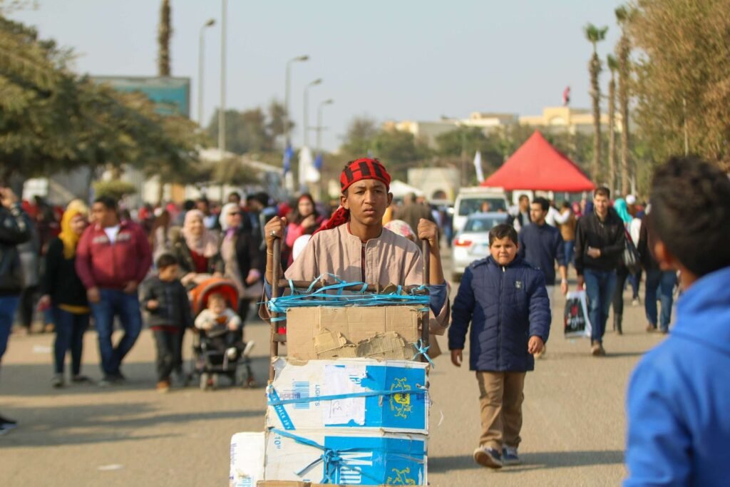 Man Pushing Metal Cart at Cairo International Book Fair – 2017 9