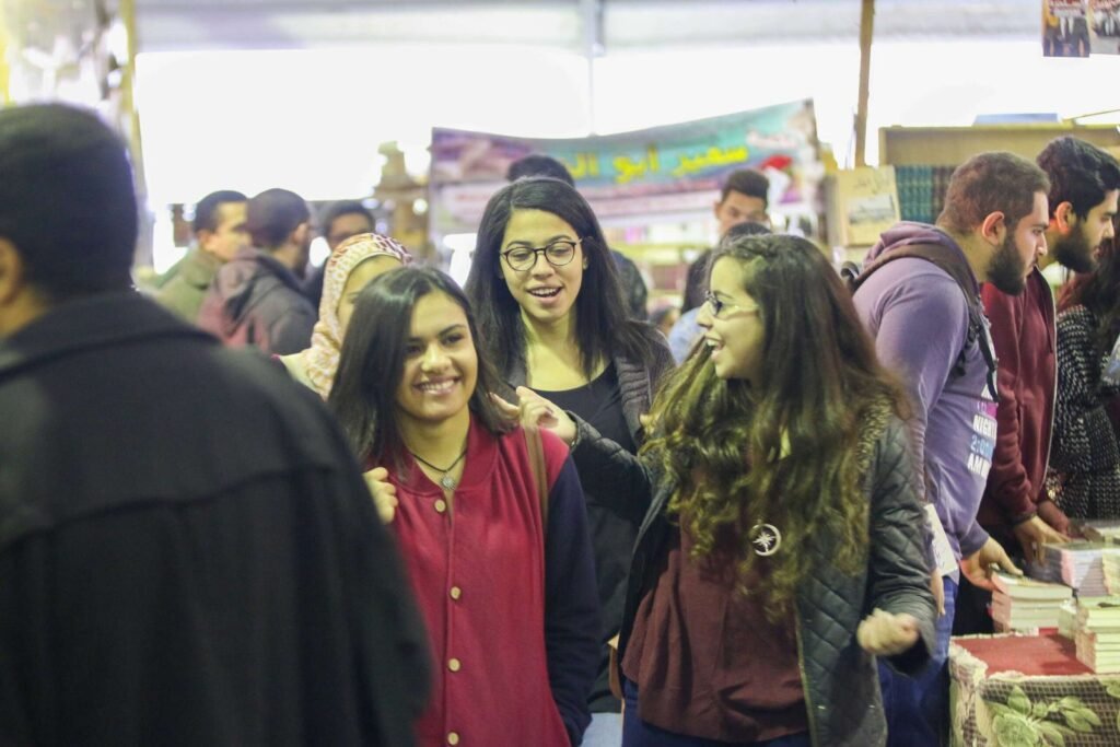 Smiling Girls Walking at Cairo International Book Fair 2017