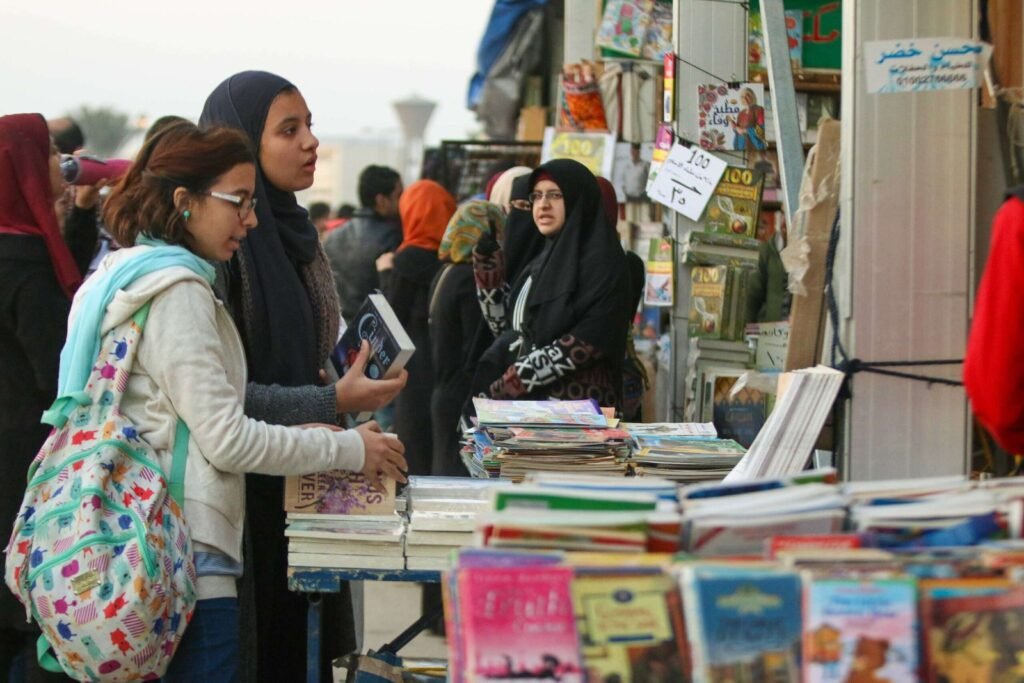 Women Browsing Book Stalls at Cairo International Book Fair 2017