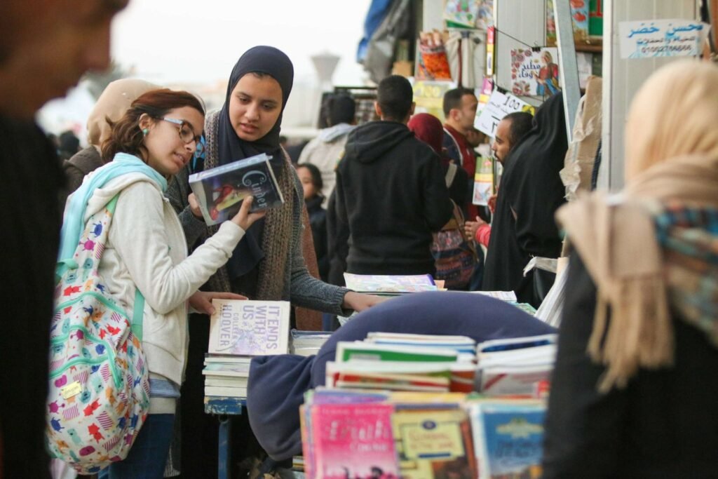Girls Choosing Books at Cairo International Book Fair 2017