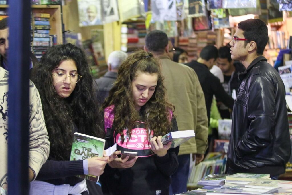 Girls Browsing Books at Cairo International Book Fair 2017
