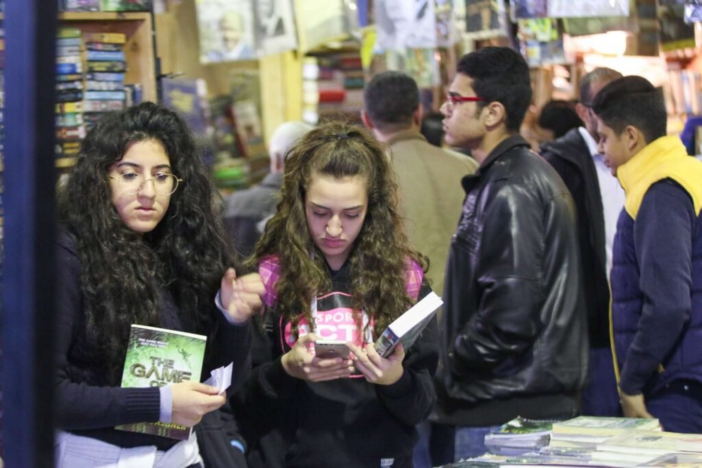 Girls Browsing Books at Cairo International Book Fair 2017 2