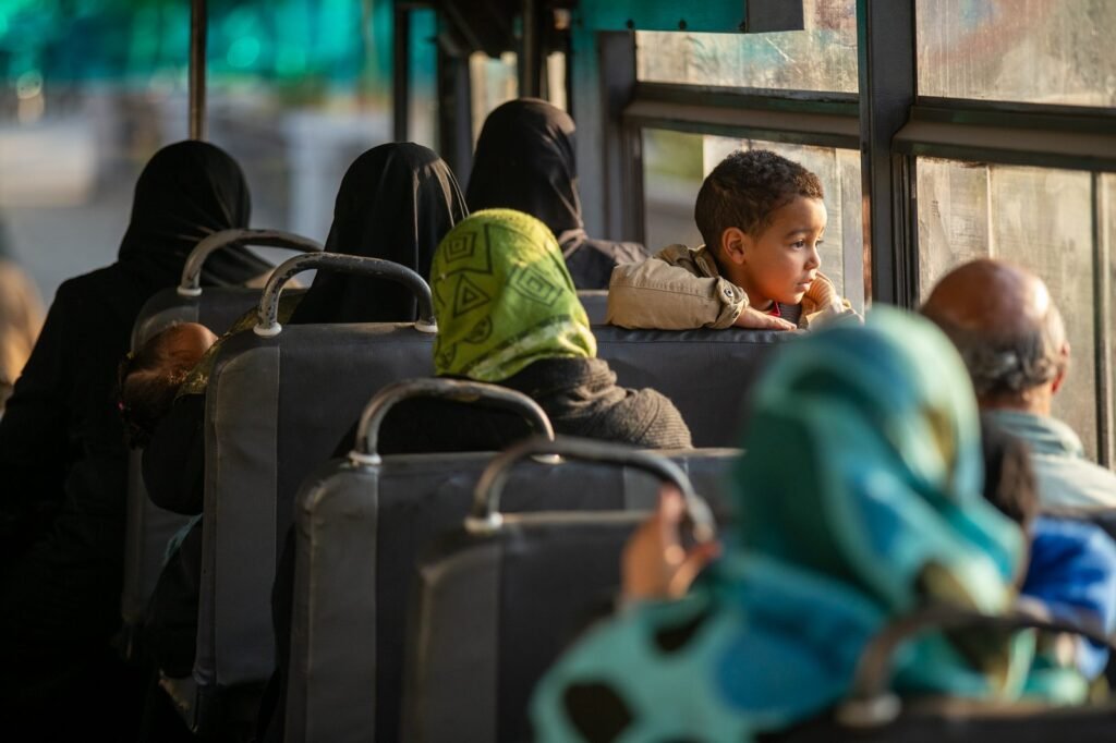 A child looking out of a bus window in Cairo, Winter 2017