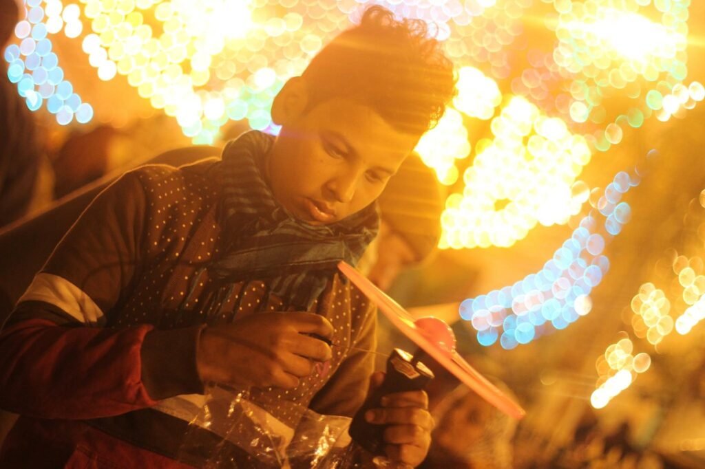 Portrait of a Child Playing at a Traditional Egyptian Mawlid – Cairo, Egypt