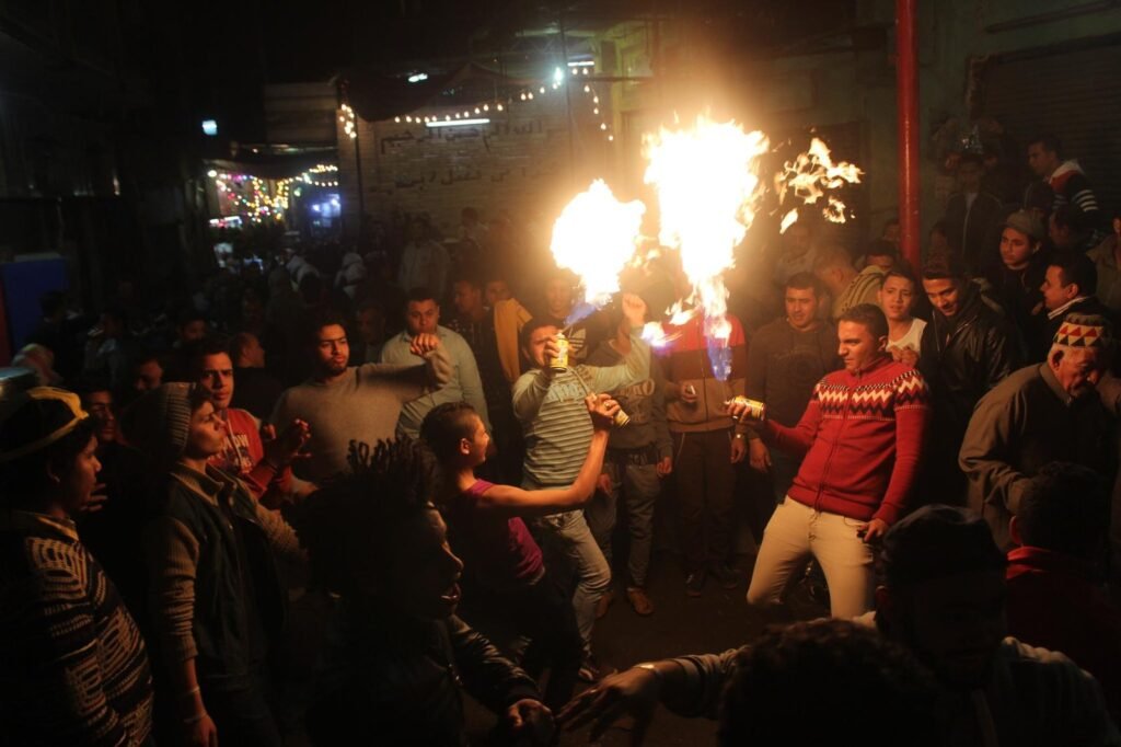 Young Men Performing Fire and Aerosol Spray Dance at Al-Hussein Mawlid – Cairo, Egypt