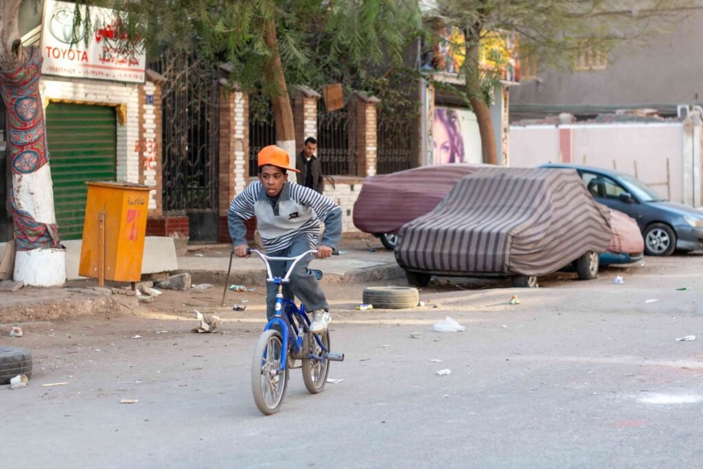 Boy on a Blue Bicycle – Sudan Street, Cairo 2017