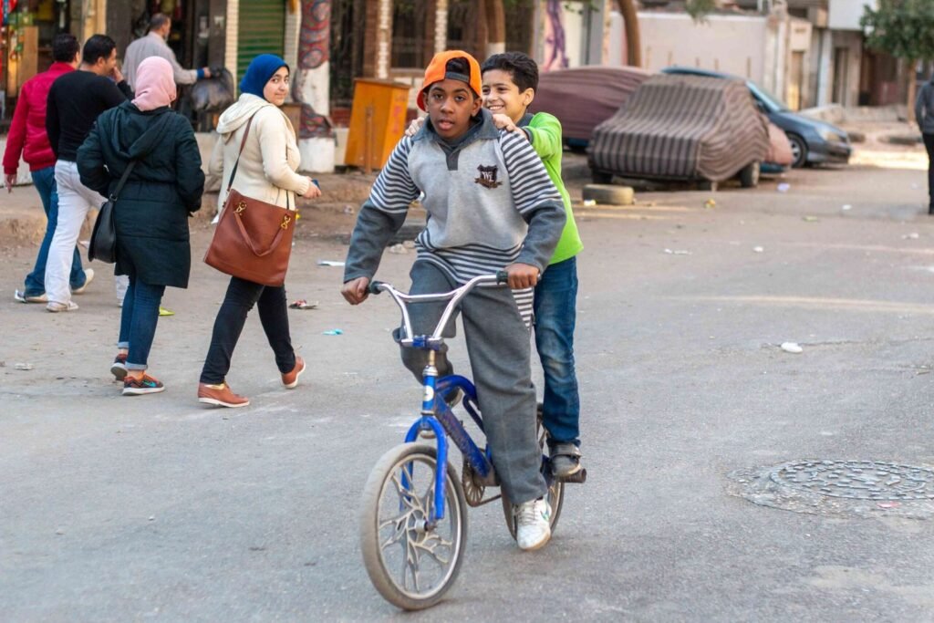 Boy on a Blue Bicycle – Sudan Street, Cairo 2017