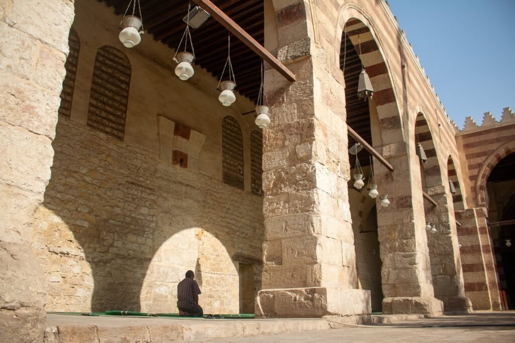 Wide Interior View of the Blue Mosque in Cairo with a Man Praying 2
