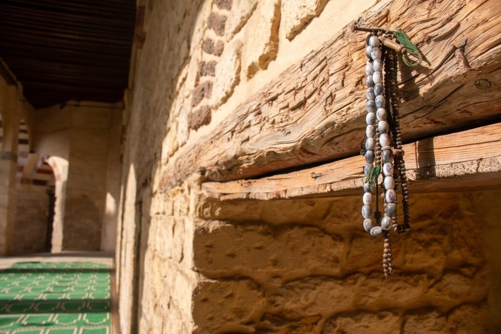 
									Hanging Prayer Beads Inside the Blue Mosque in Cairo