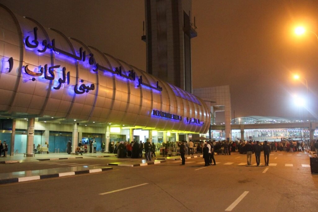A nighttime view of Cairo International Airport during the winter.
