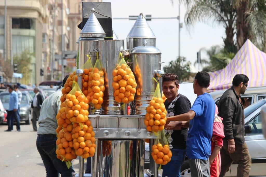 Fresh Orange Juice Cart at the Car Market in Nasr City – A Refreshing Cairo Street Scene
