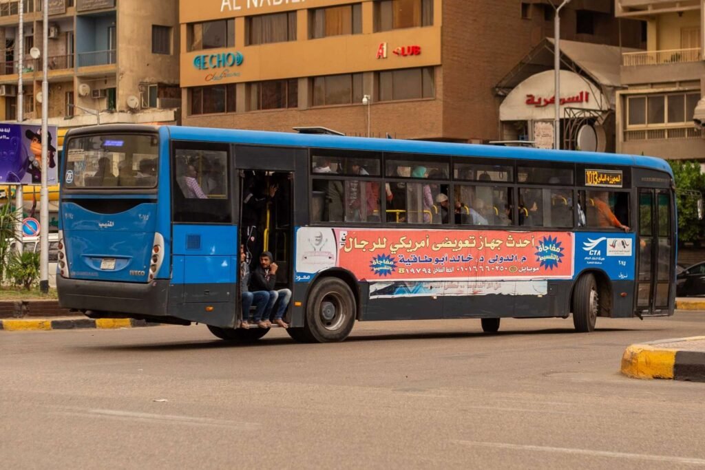 Blue City Bus with Arabic Advertisement in Cairo