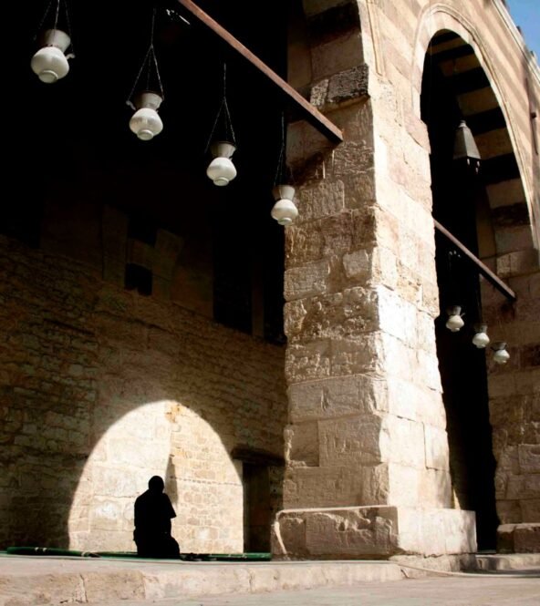 A man praying inside the Blue Mosque in Old Cairo