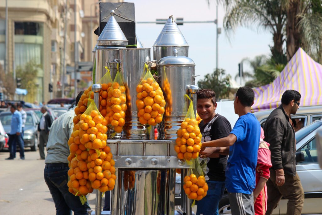 Vendor Selling Fresh Orange Juice from a Cart in Cairo, Egypt 2